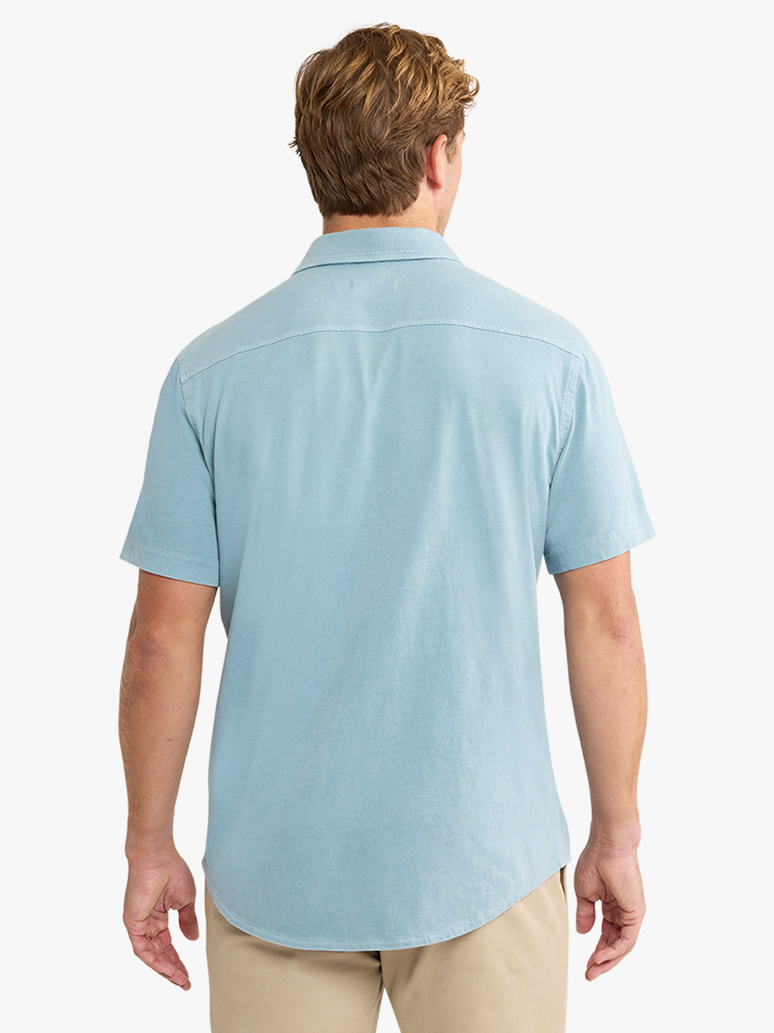 Man wearing a bay blue short-sleeve button-up shirt with a collared neckline, shown from the back.