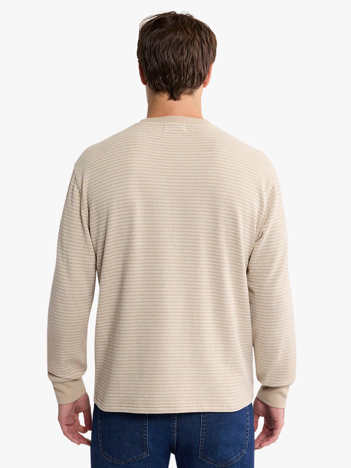 Man wearing a natural-colored terry crewneck sweatshirt with horizontal ribbed texture, shown from behind.