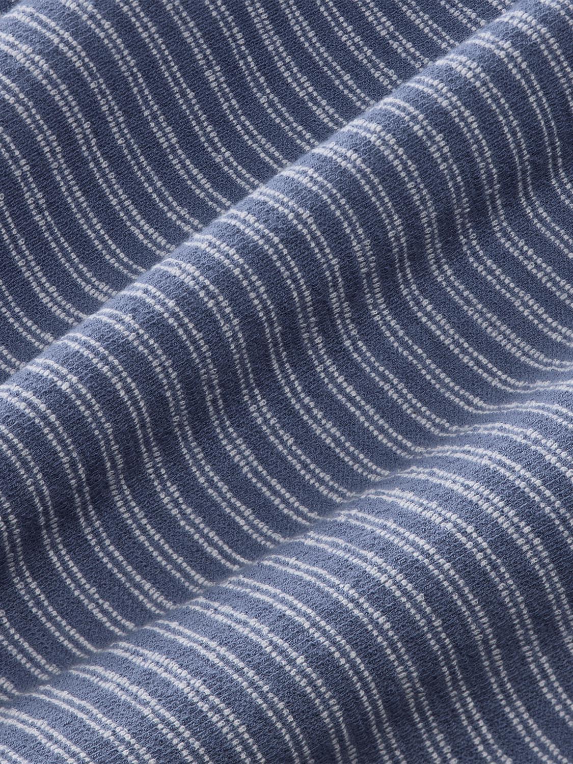 Navy blue terry crewneck fabric with white maritime stripe pattern and textured weave detail.