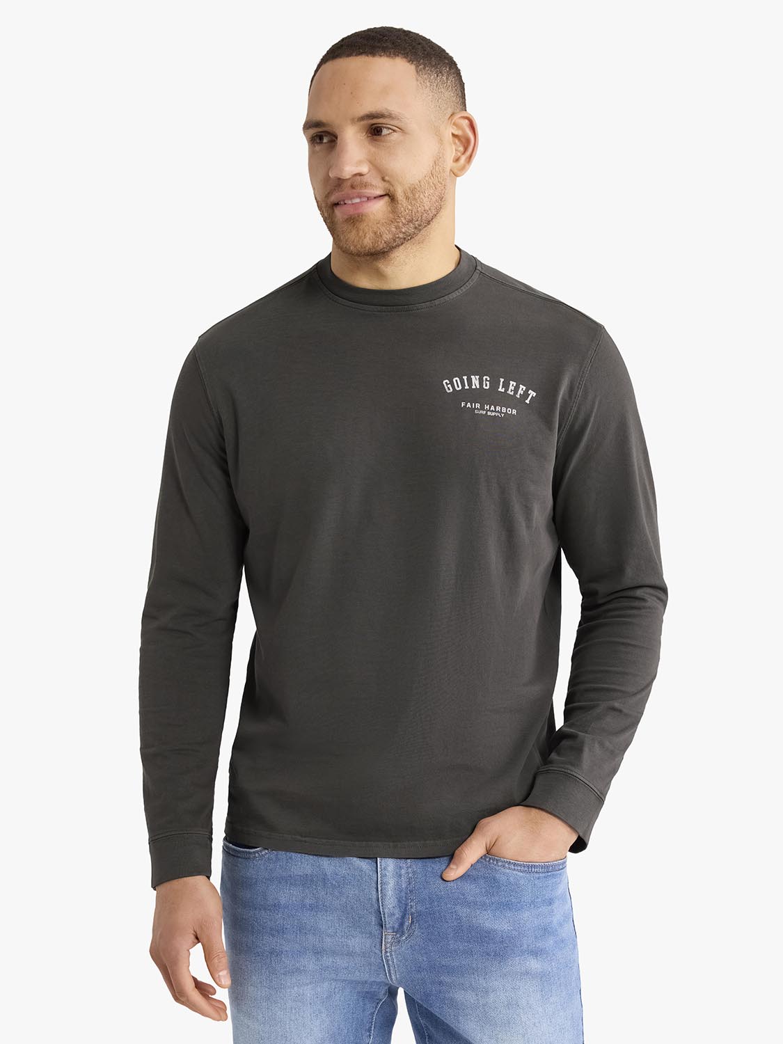Man wearing a charcoal long sleeve graphic tee with 