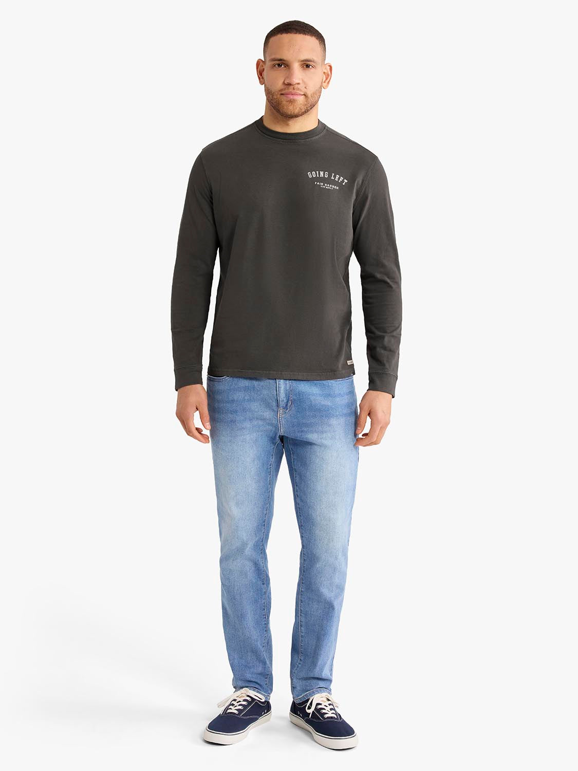 Man wearing charcoal long sleeve graphic tee with 