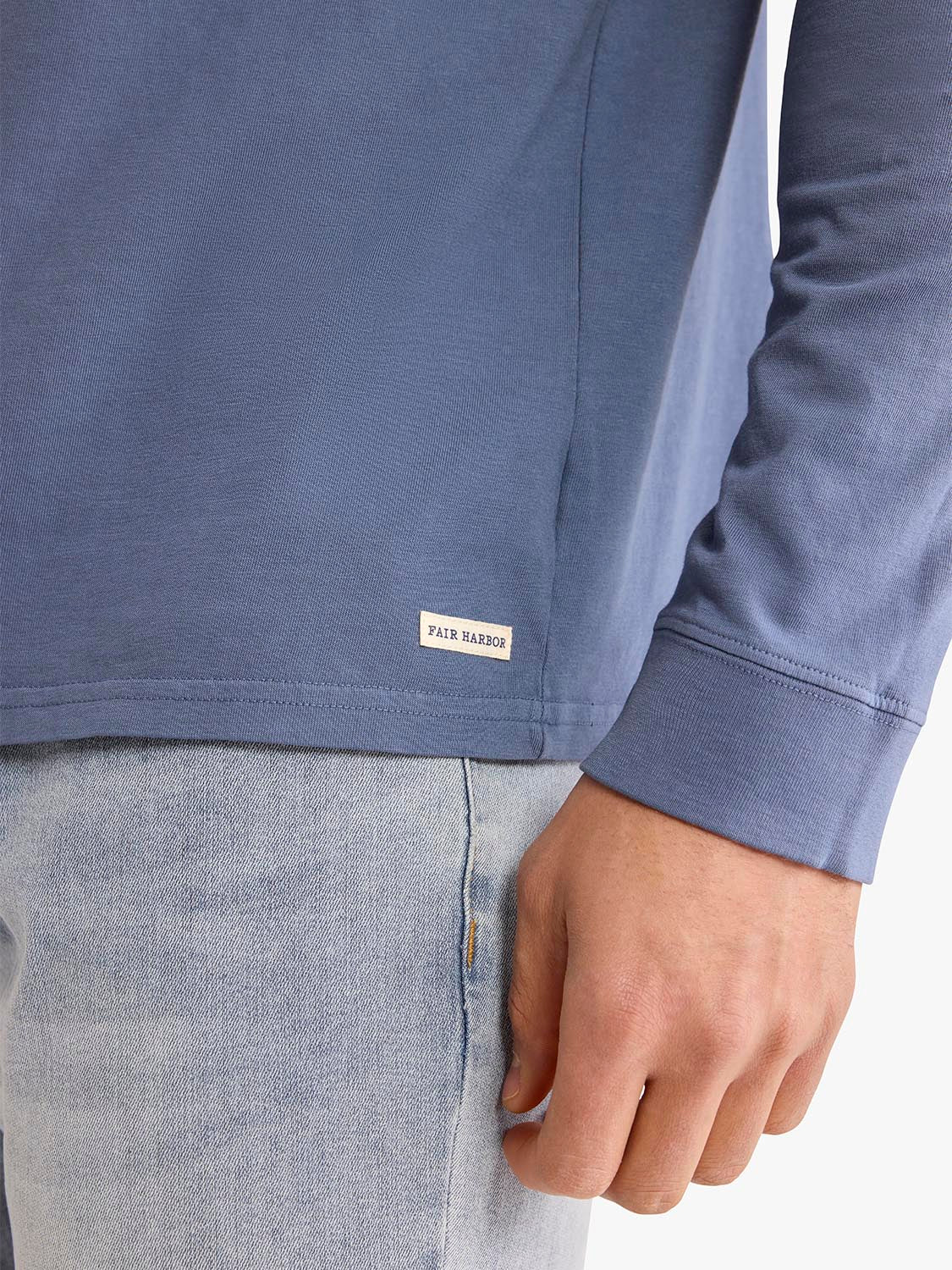 Blue long sleeve shirt with Fair Harbor label visible on the front.