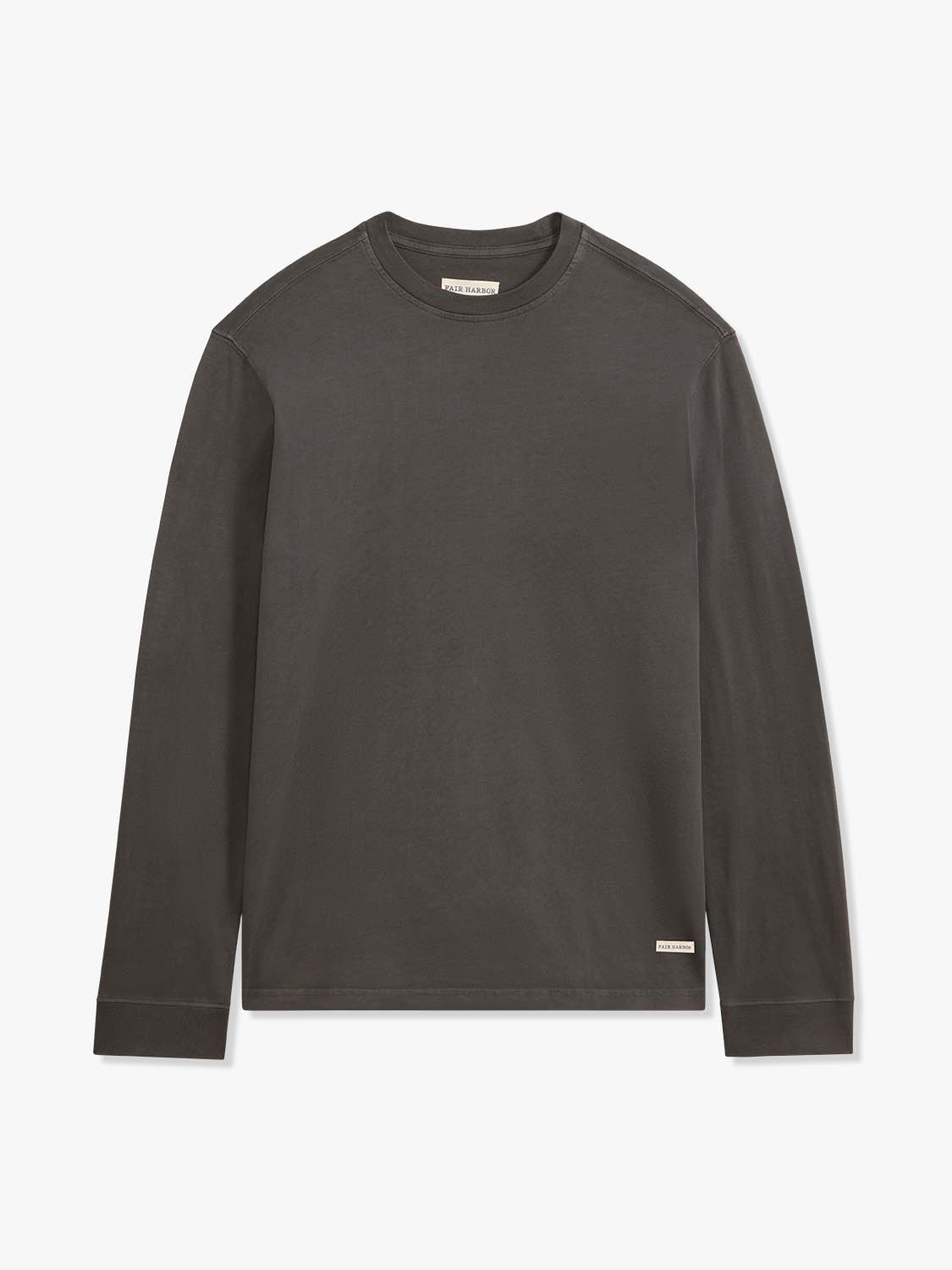 Black long sleeve tee with crew neckline and small brand label on lower right.