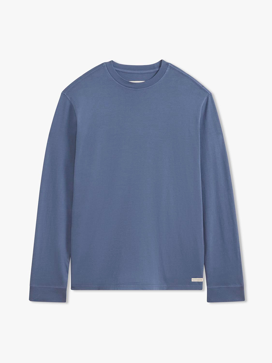 Navy long sleeve tee with crew neckline and ribbed cuffs displayed flat against white background.