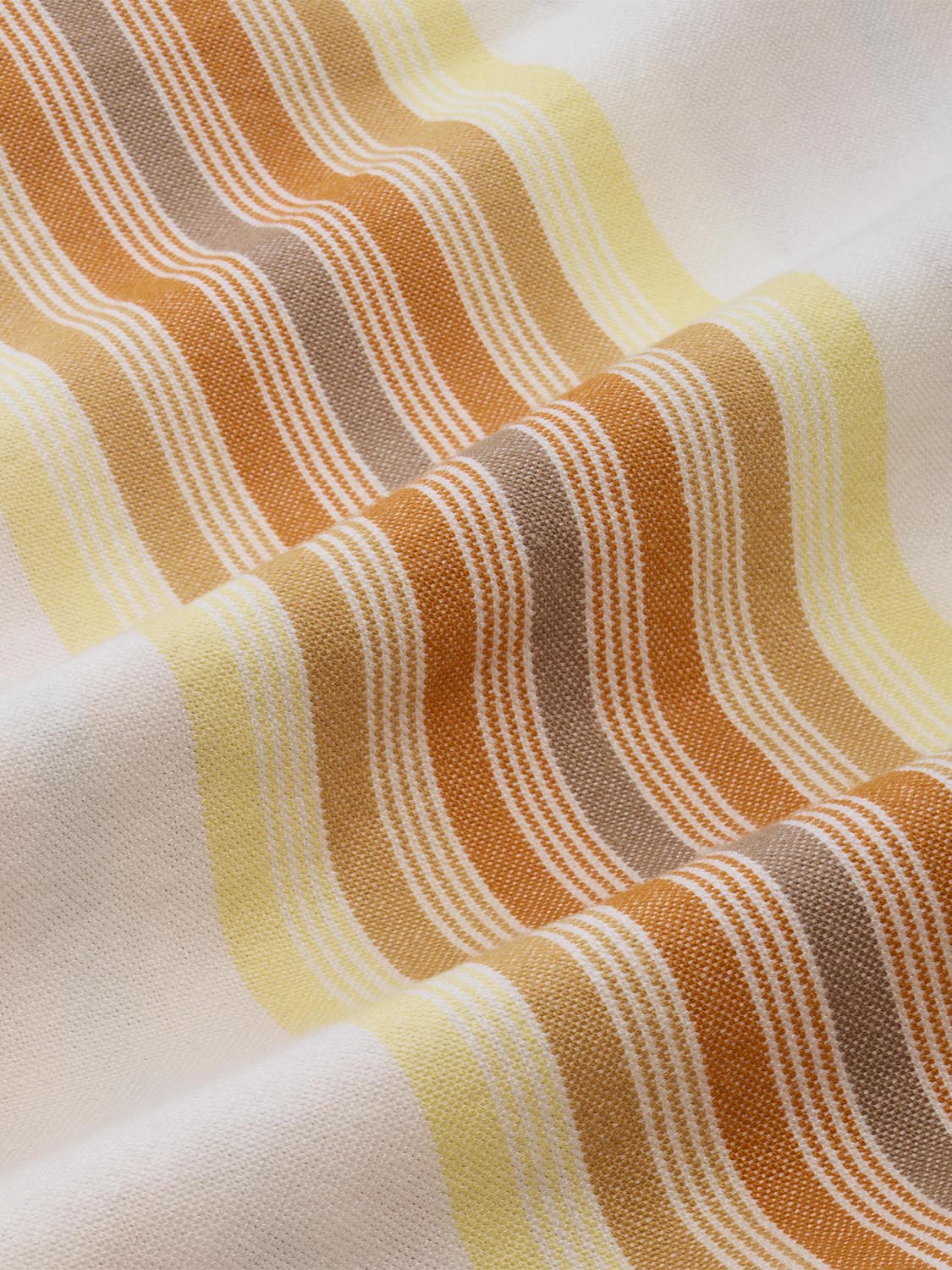 Cotton oxford shirt fabric features vertical stripes in orange, yellow, and white tones.