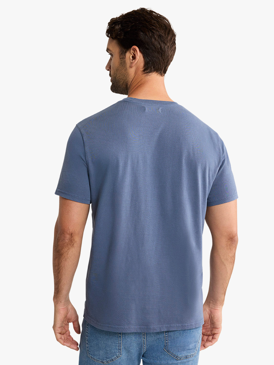 Man wearing a navy blue short-sleeved crew neck t-shirt, shown from behind.