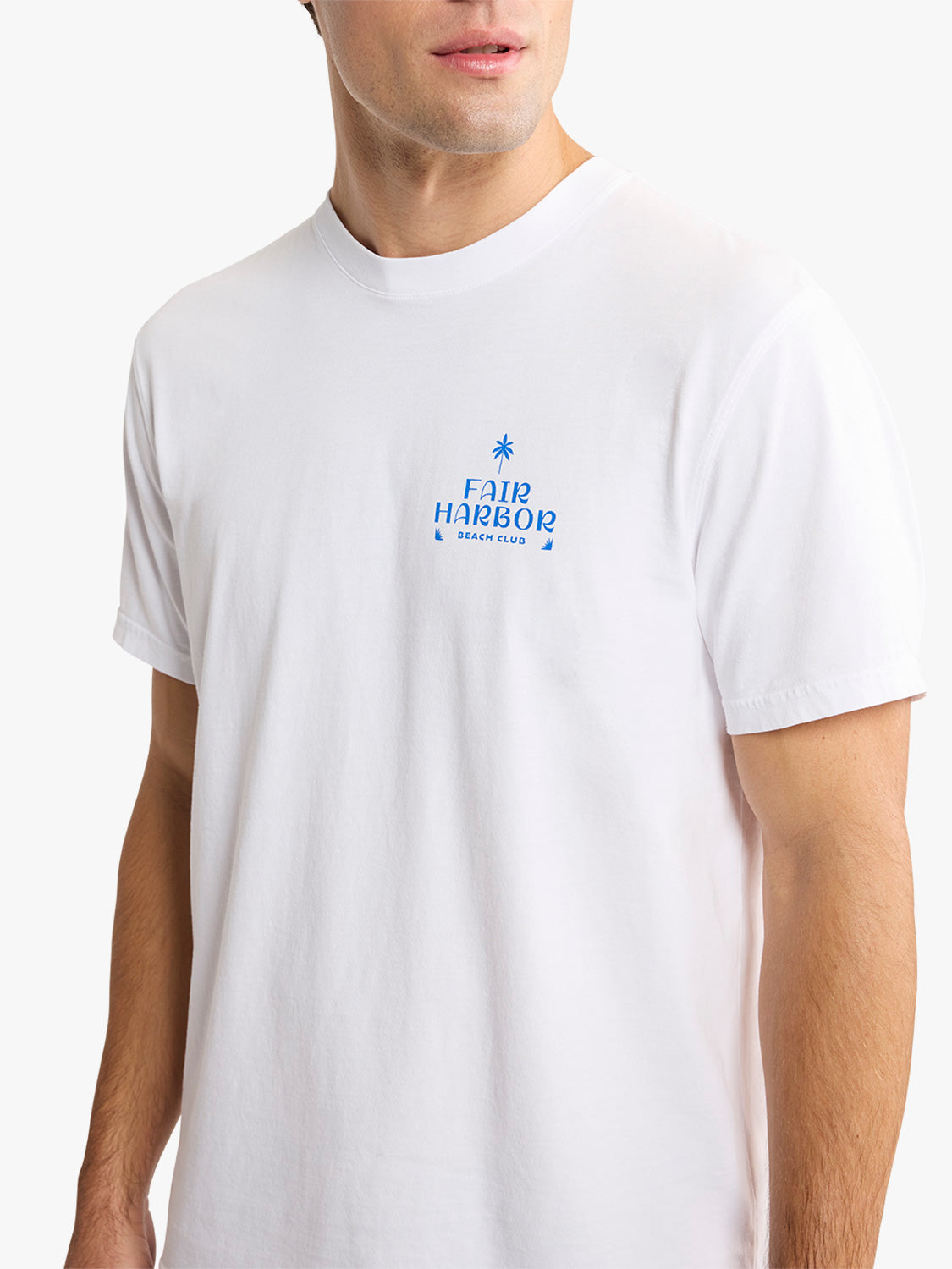 White short-sleeve crew neck t-shirt with small blue Fair Harbor Beach Club graphic on chest.