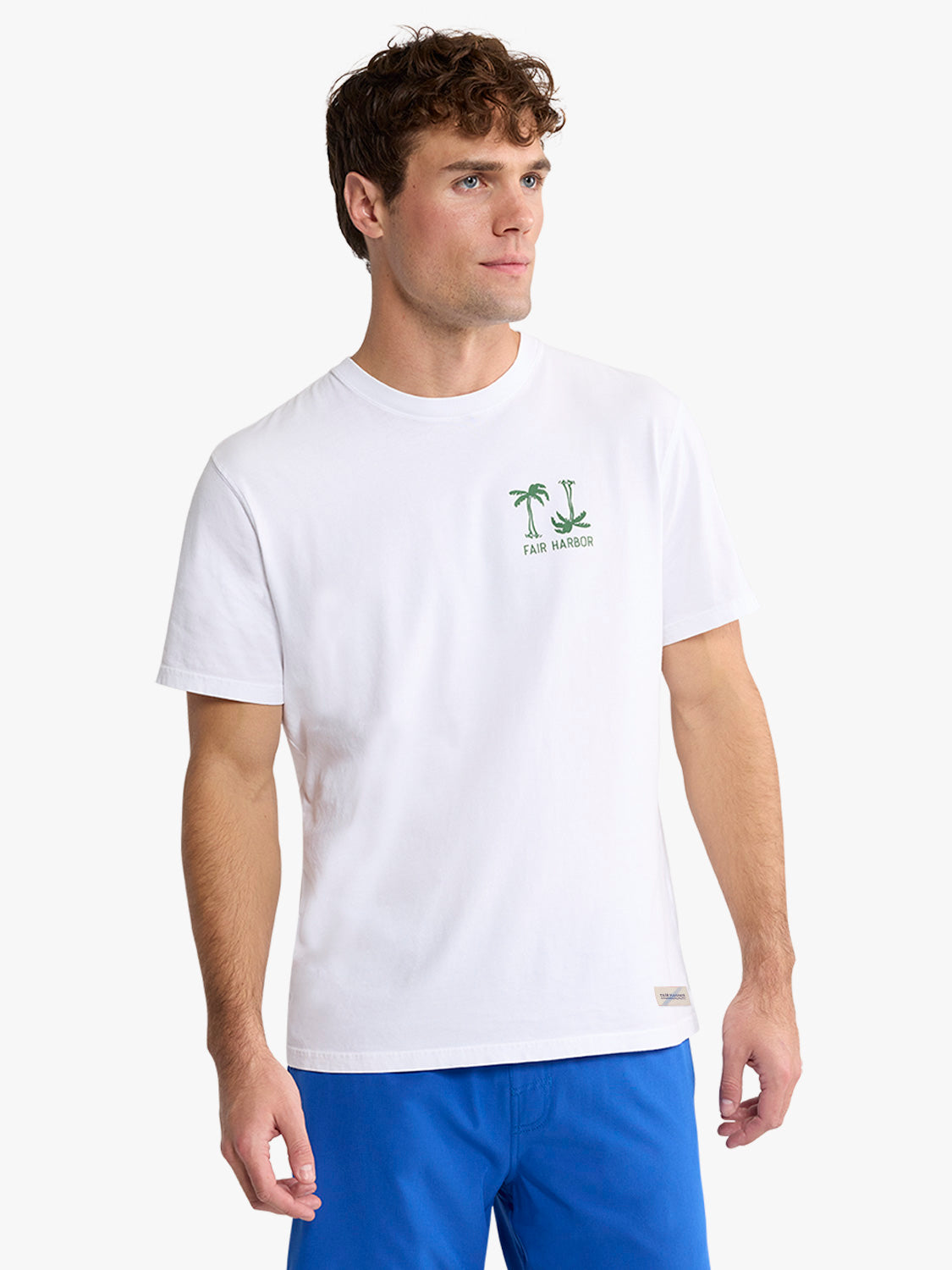 White short-sleeve t-shirt featuring a small palm tree graphic with text on the chest.