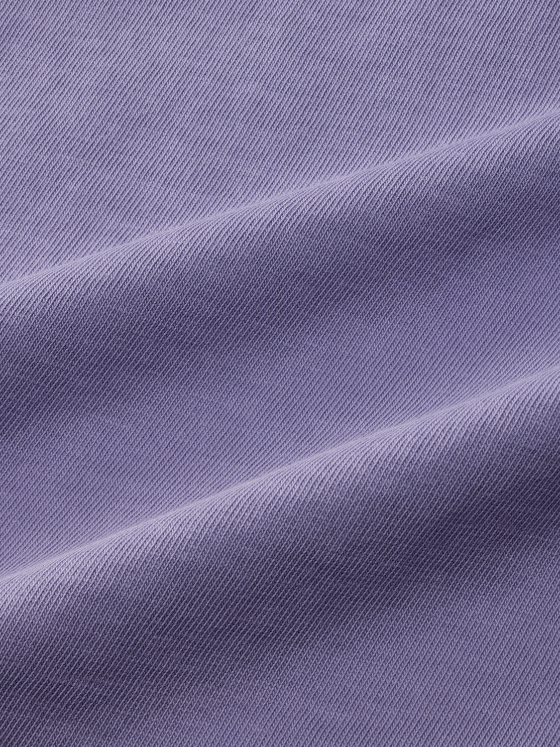 Dusk blue ribbed fabric with diagonal texture and subtle shadow patterns throughout.