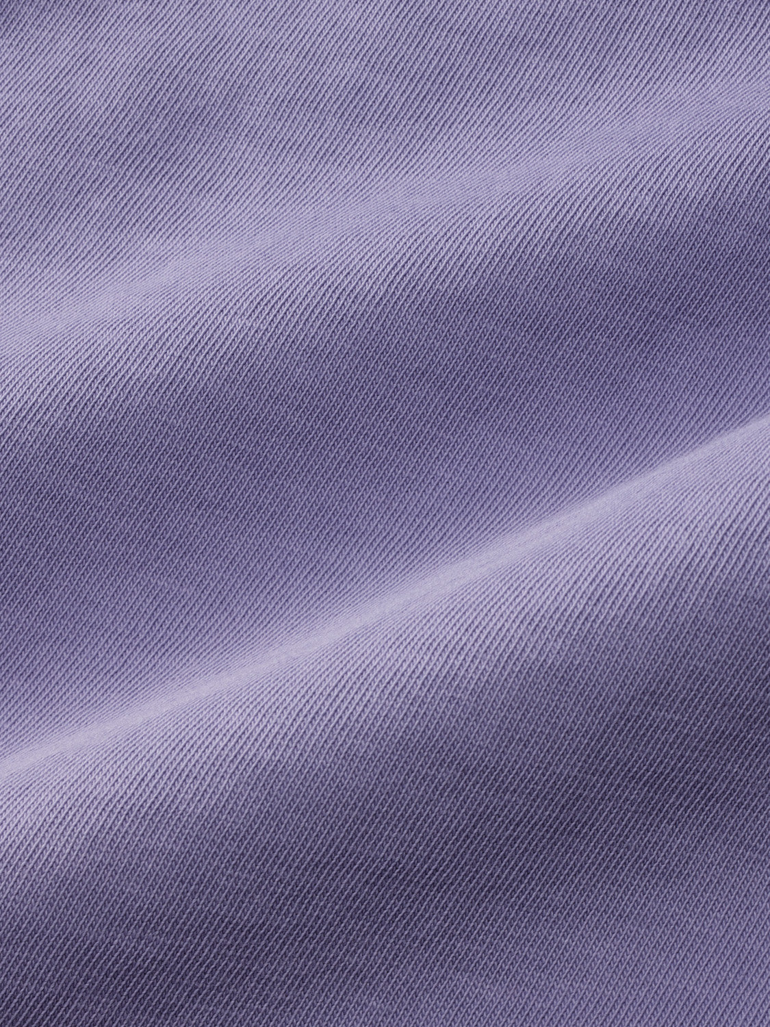 Lavender-colored t-shirt with textured diagonal ribbed fabric displayed flat against a plain background.