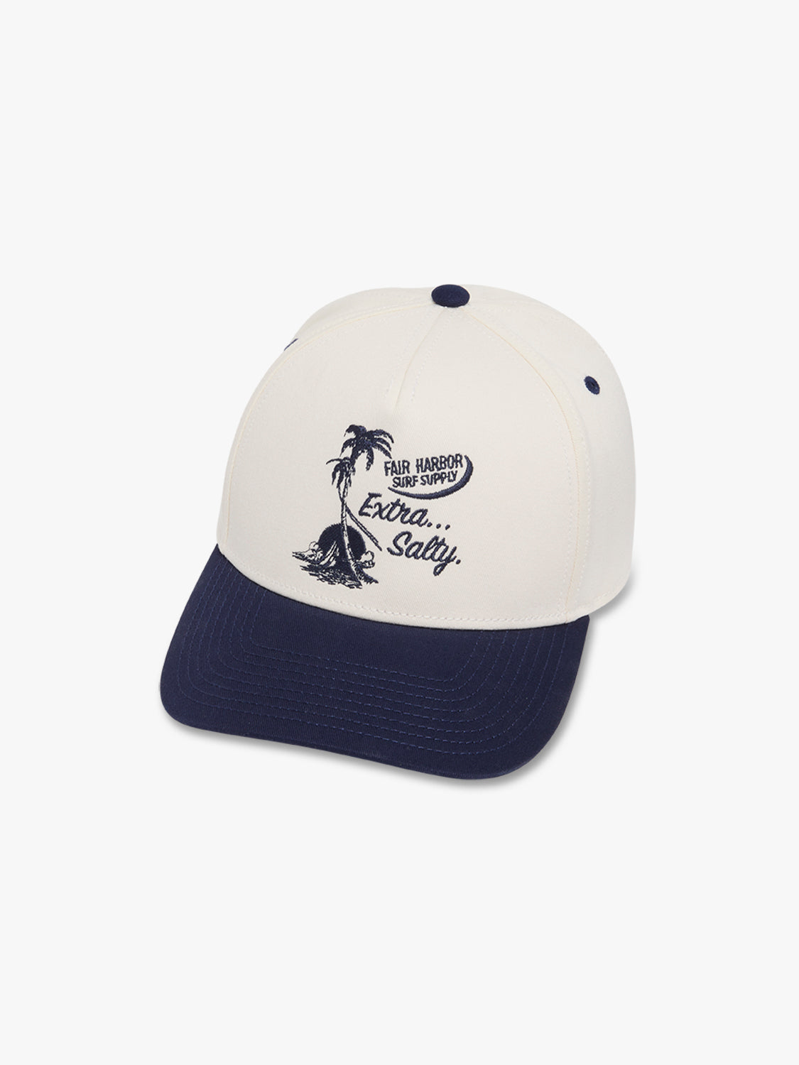 Cream and navy snapback hat with palm tree and sailing boat embroidery on front crown.