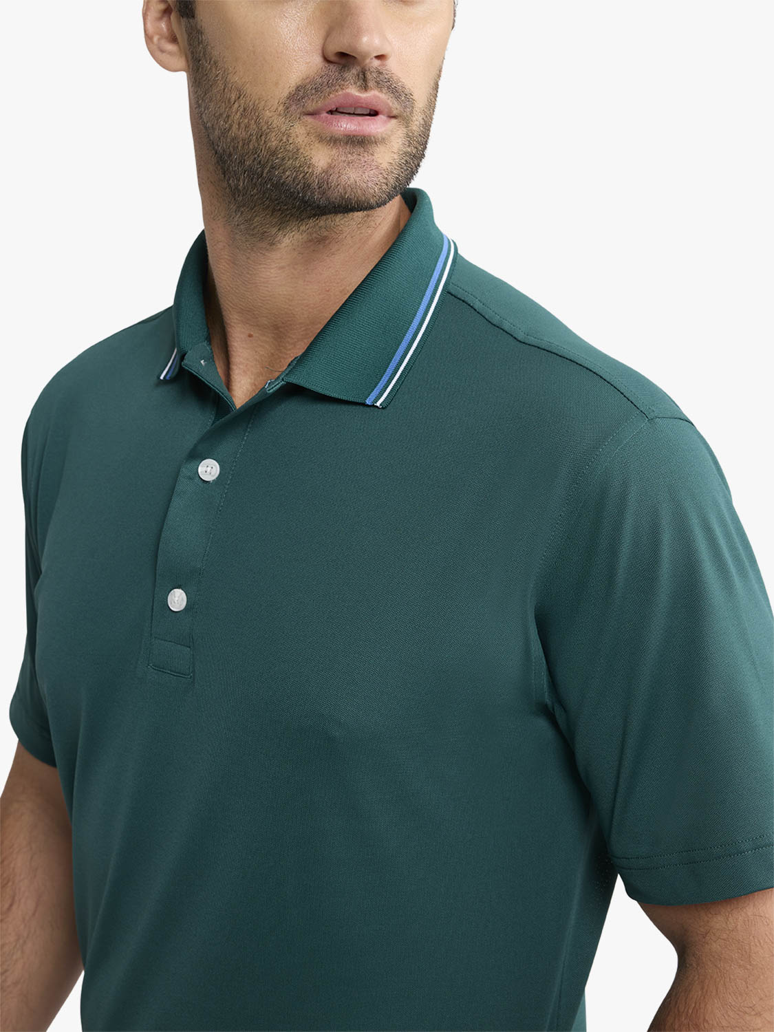 Man wearing a fairway green pique polo shirt with white button details and striped collar.