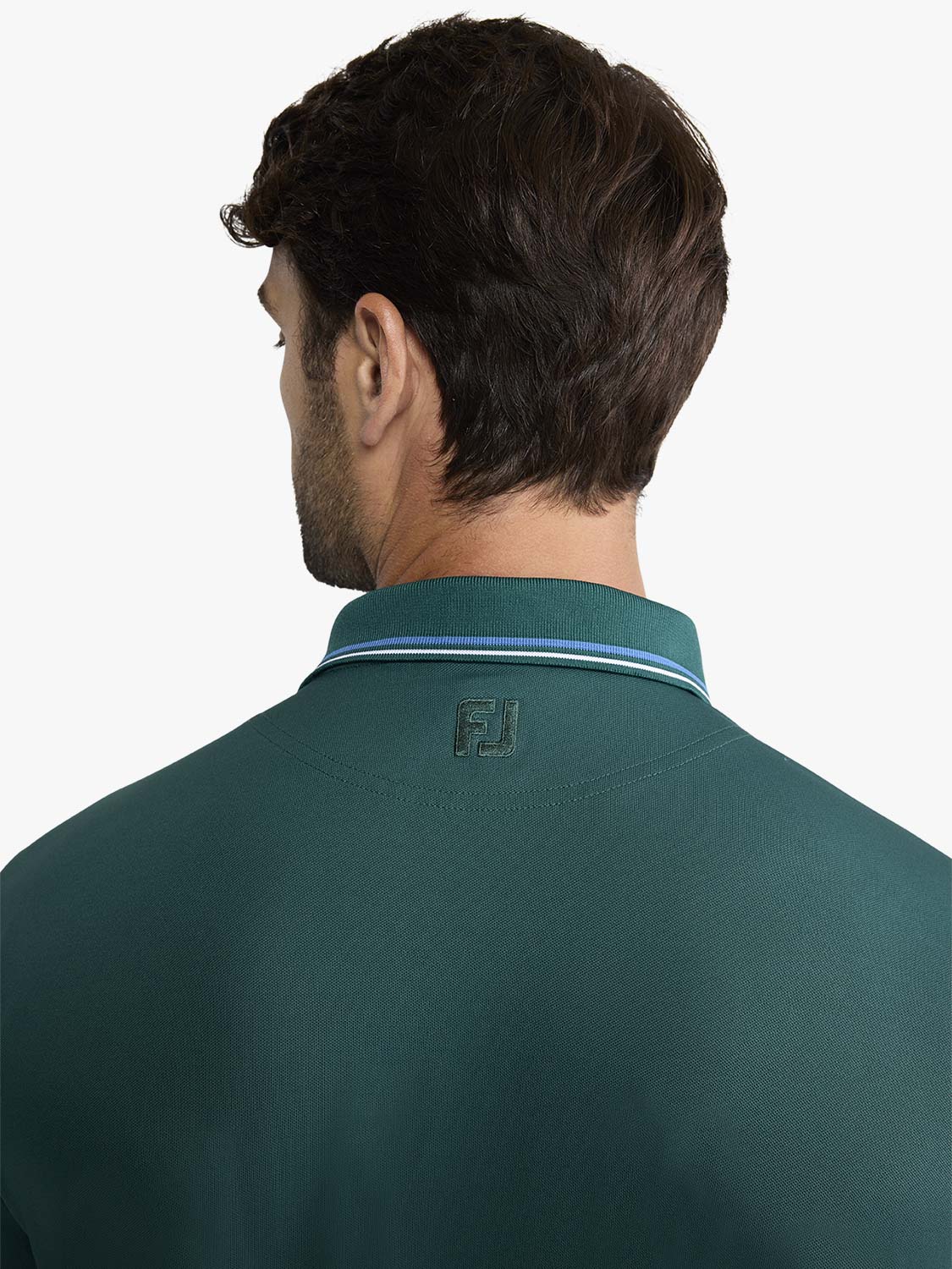 Man wearing fairway green pique polo shirt with striped collar, shown from back view.