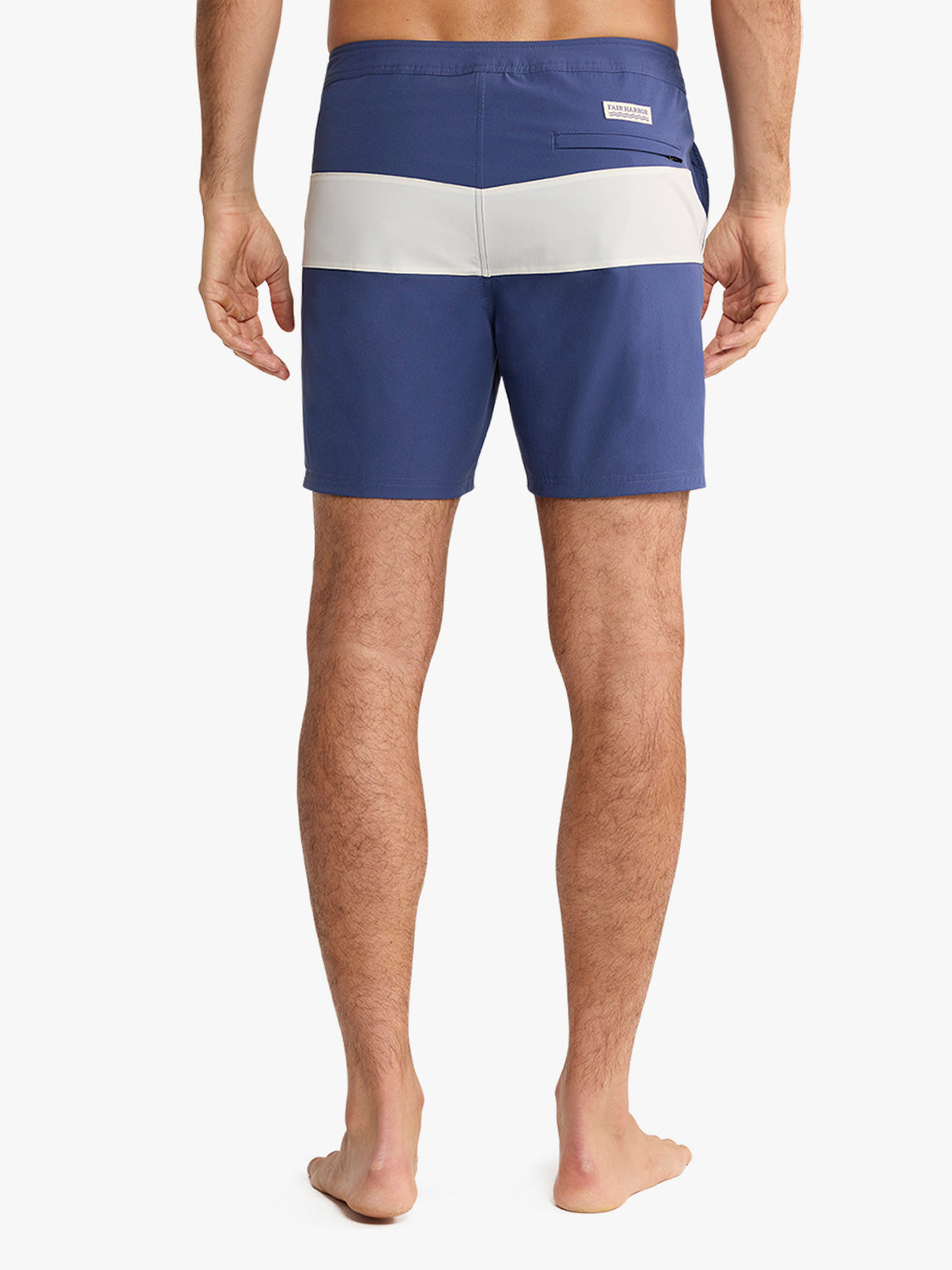 Navy and white striped board short with horizontal color blocking and back patch pocket.