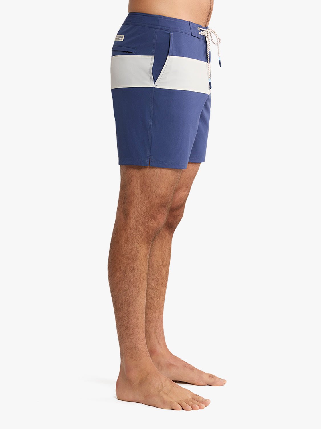Navy and white striped board shorts with drawstring closure on male model.
