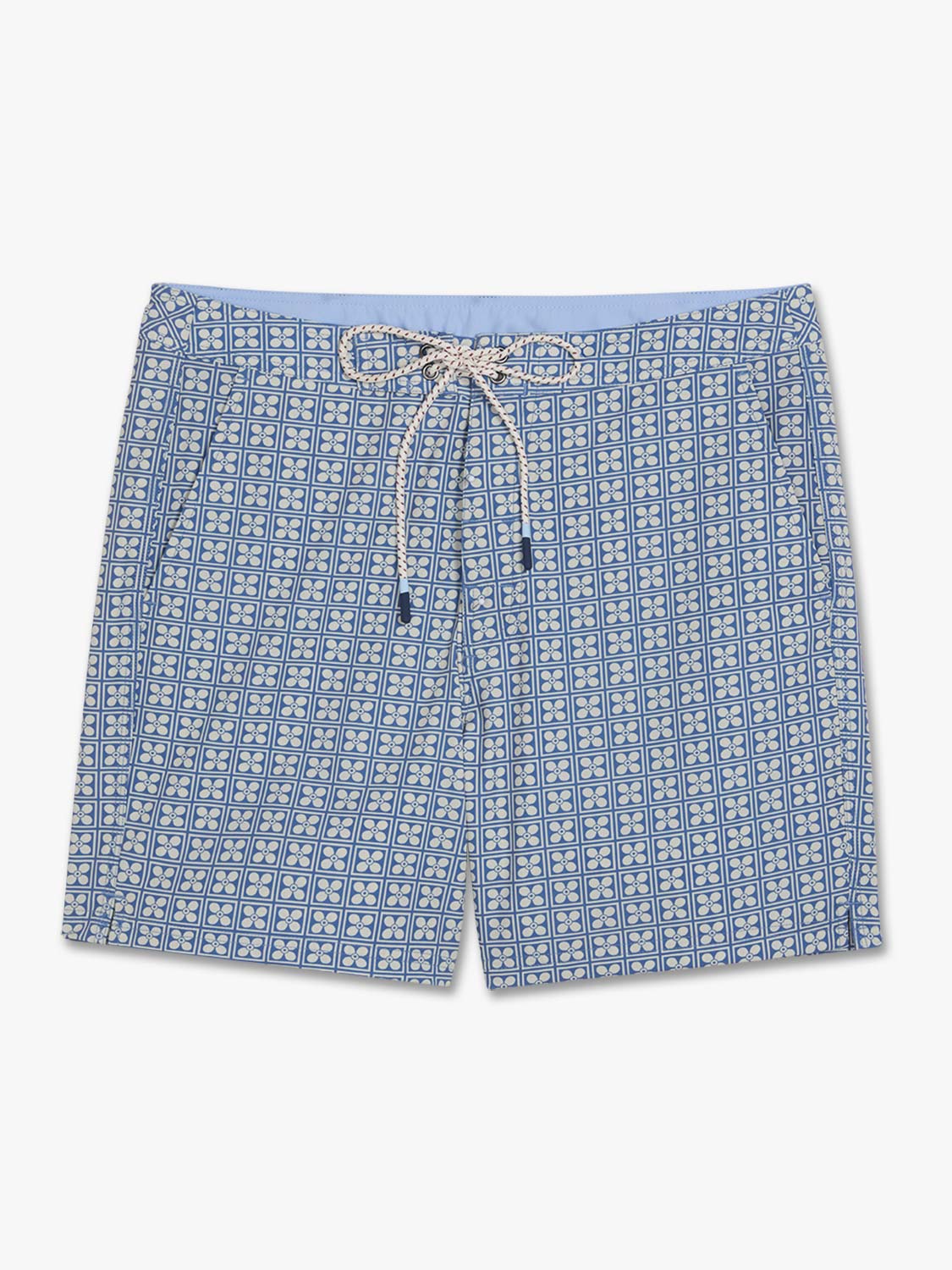 Blue board shorts with a geometric floral pattern and drawstring waistband displayed flat.