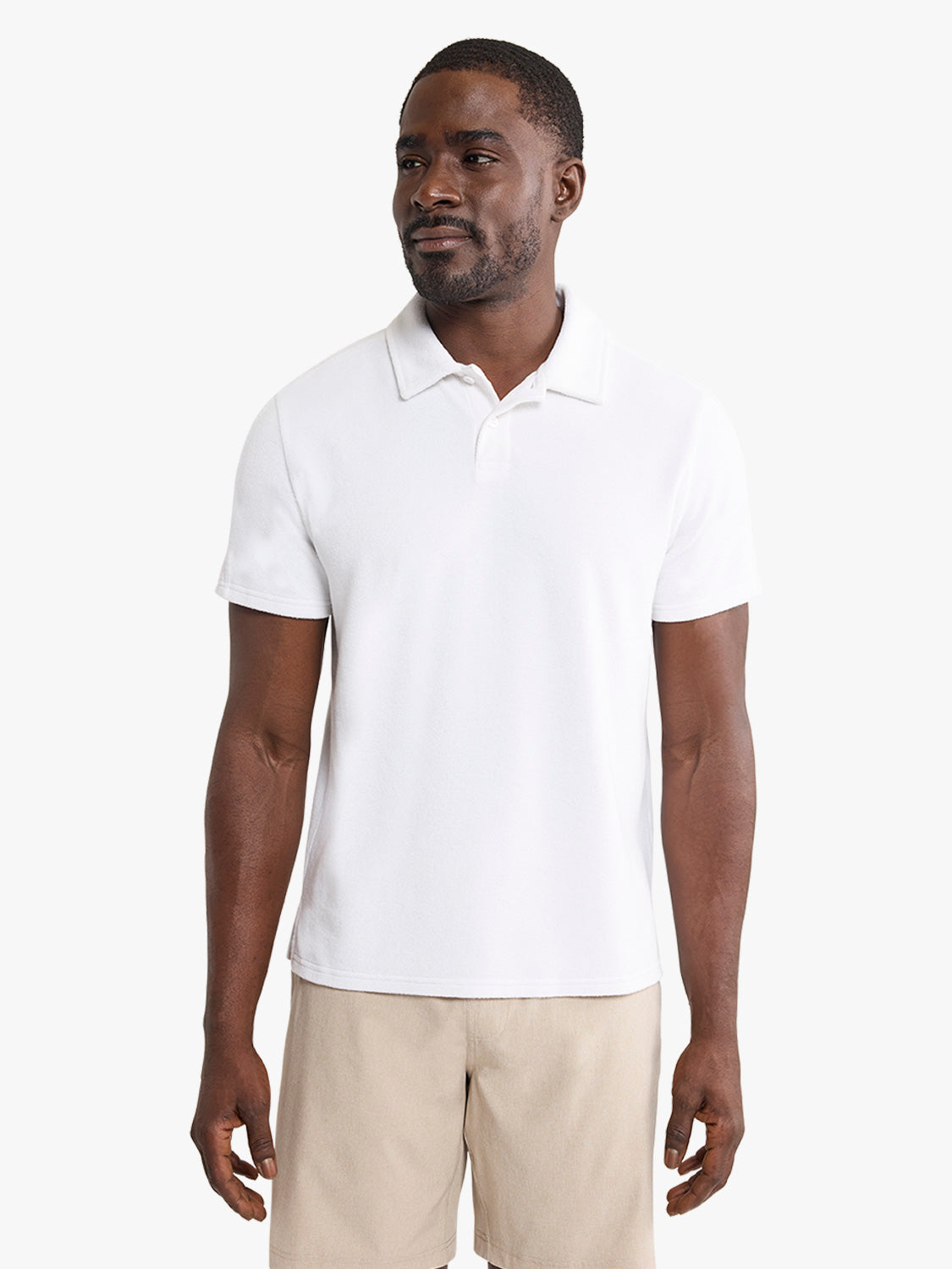 Man wearing a white short-sleeve polo shirt with a collar and button front.