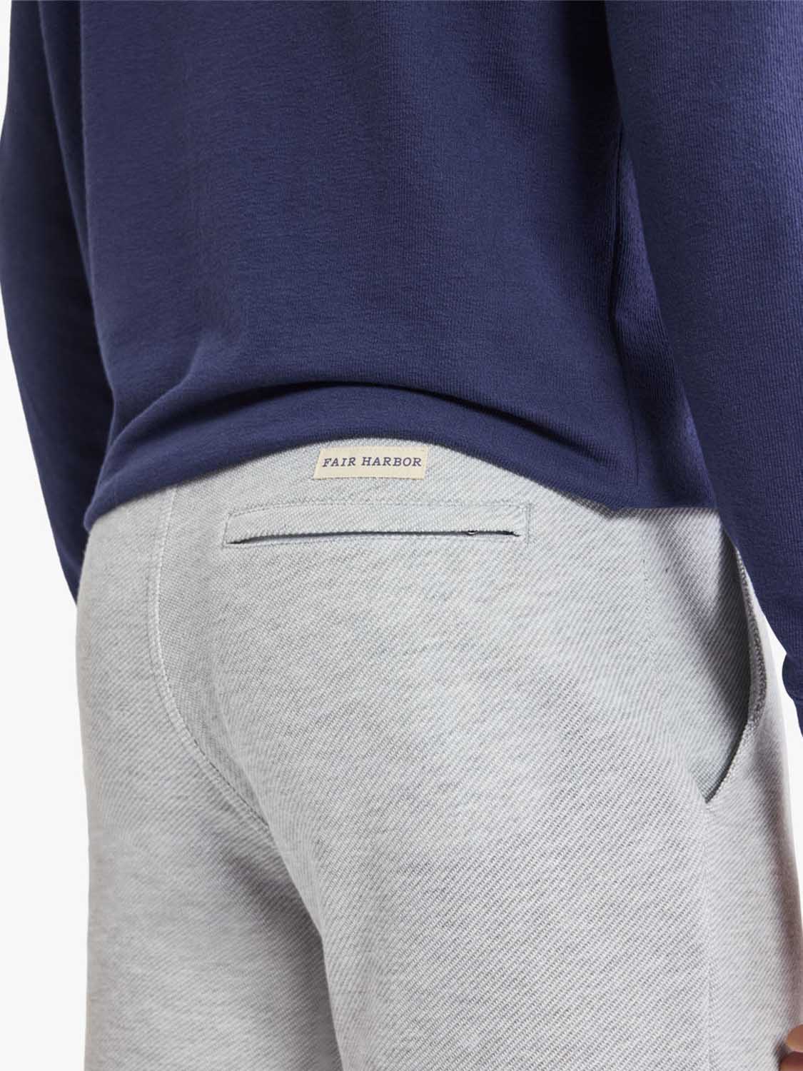 Heather grey sweatpants with an elastic waistband and a back pocket detail visible from behind.