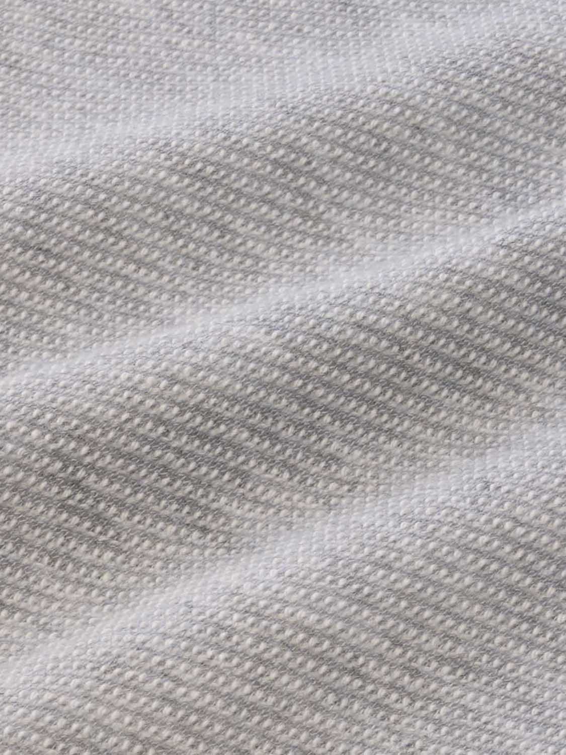Heather grey sweatpant fabric displays a textured waffle knit weave pattern in neutral tones.