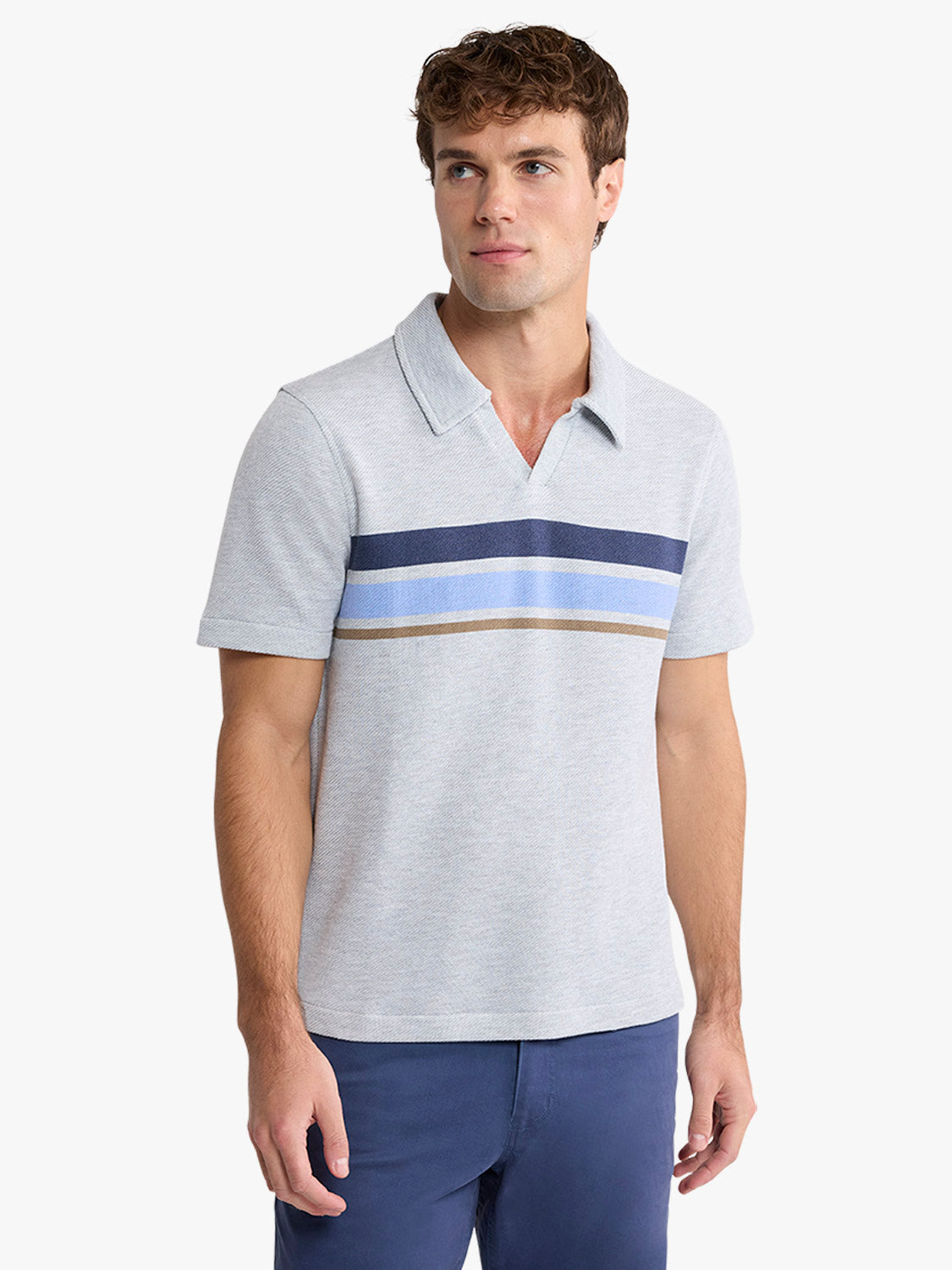 Man wearing heather grey polo shirt with navy, light blue, and tan horizontal stripes across chest.