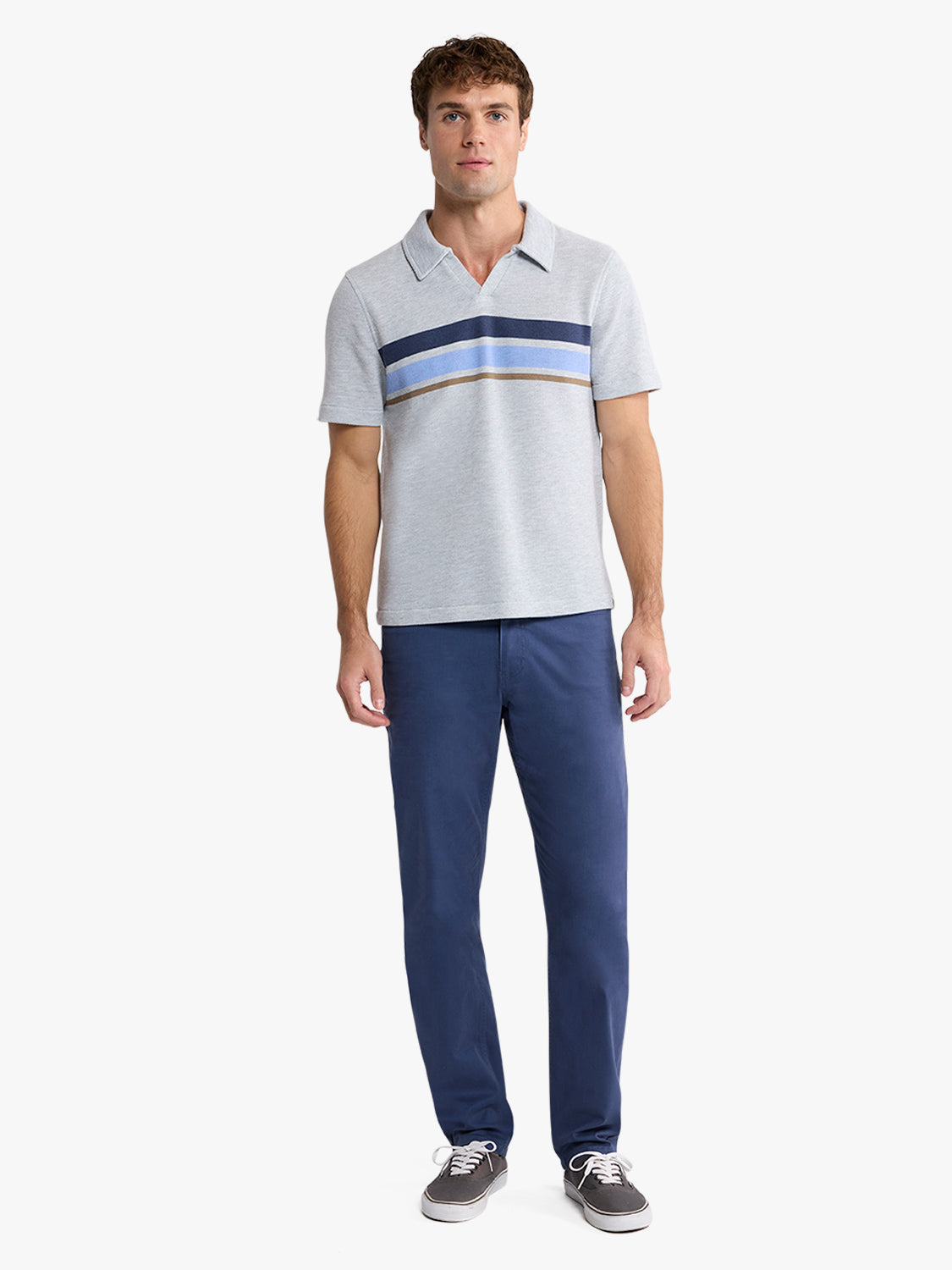Man wearing a heather grey polo shirt with horizontal navy and blue stripes across the chest.